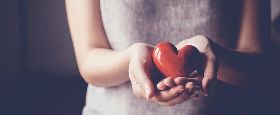 girl holding heart