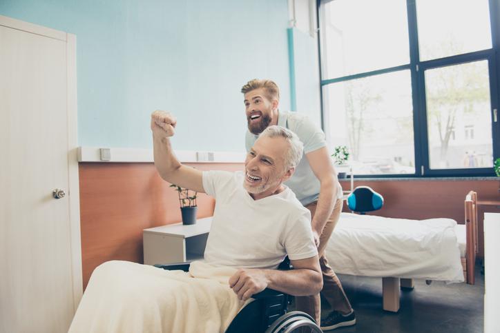 Man with physio pushing behind